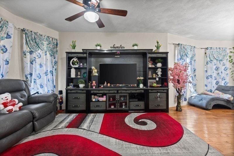 18 Baker Road Everett, MA 02149 - Photo 7 of 31 a living room with furniture and a fireplace