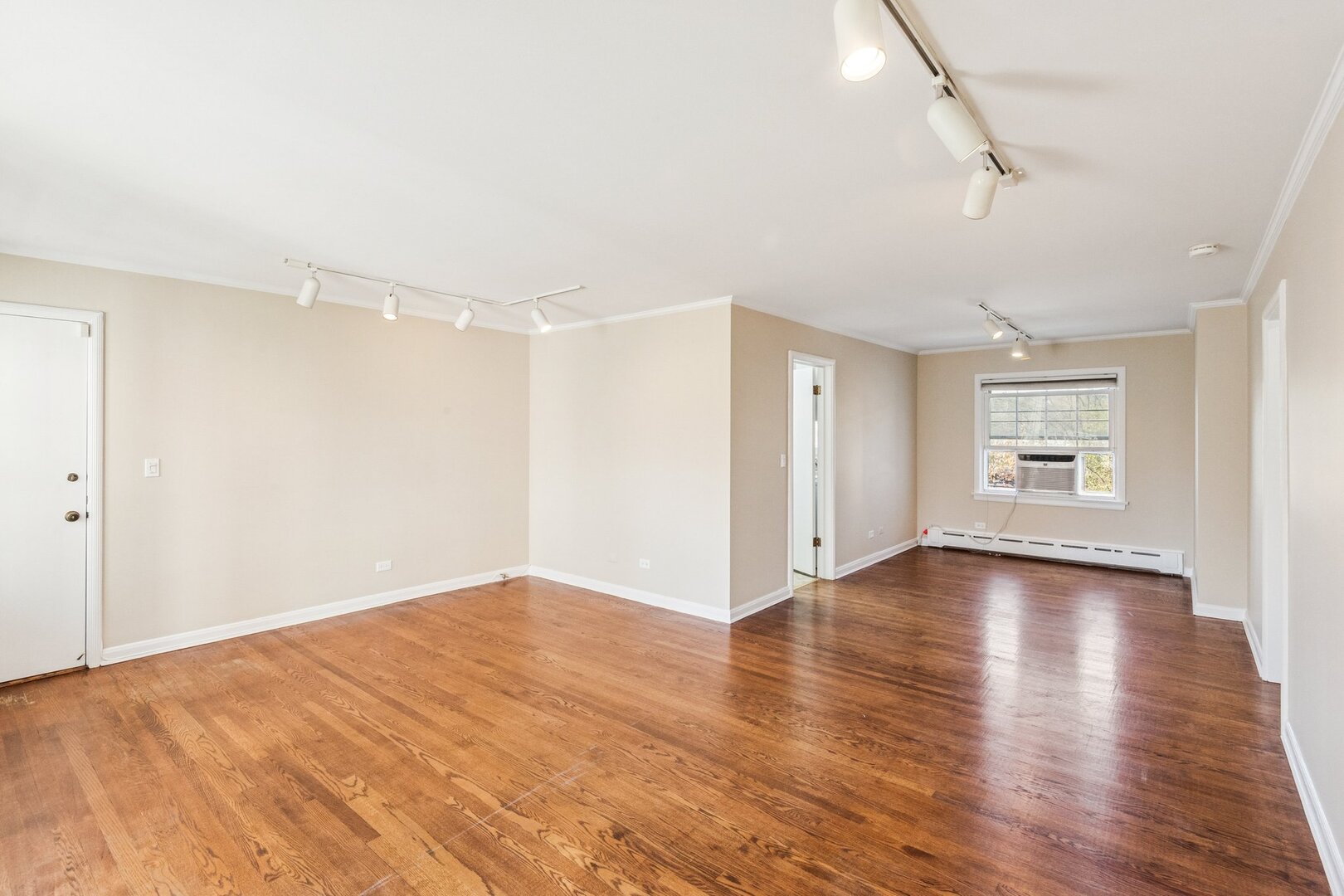 2252 Sherman Avenue, Unit 2 Evanston, IL 60201 - Photo 11 of 24 a view of empty room with wooden floor and fan