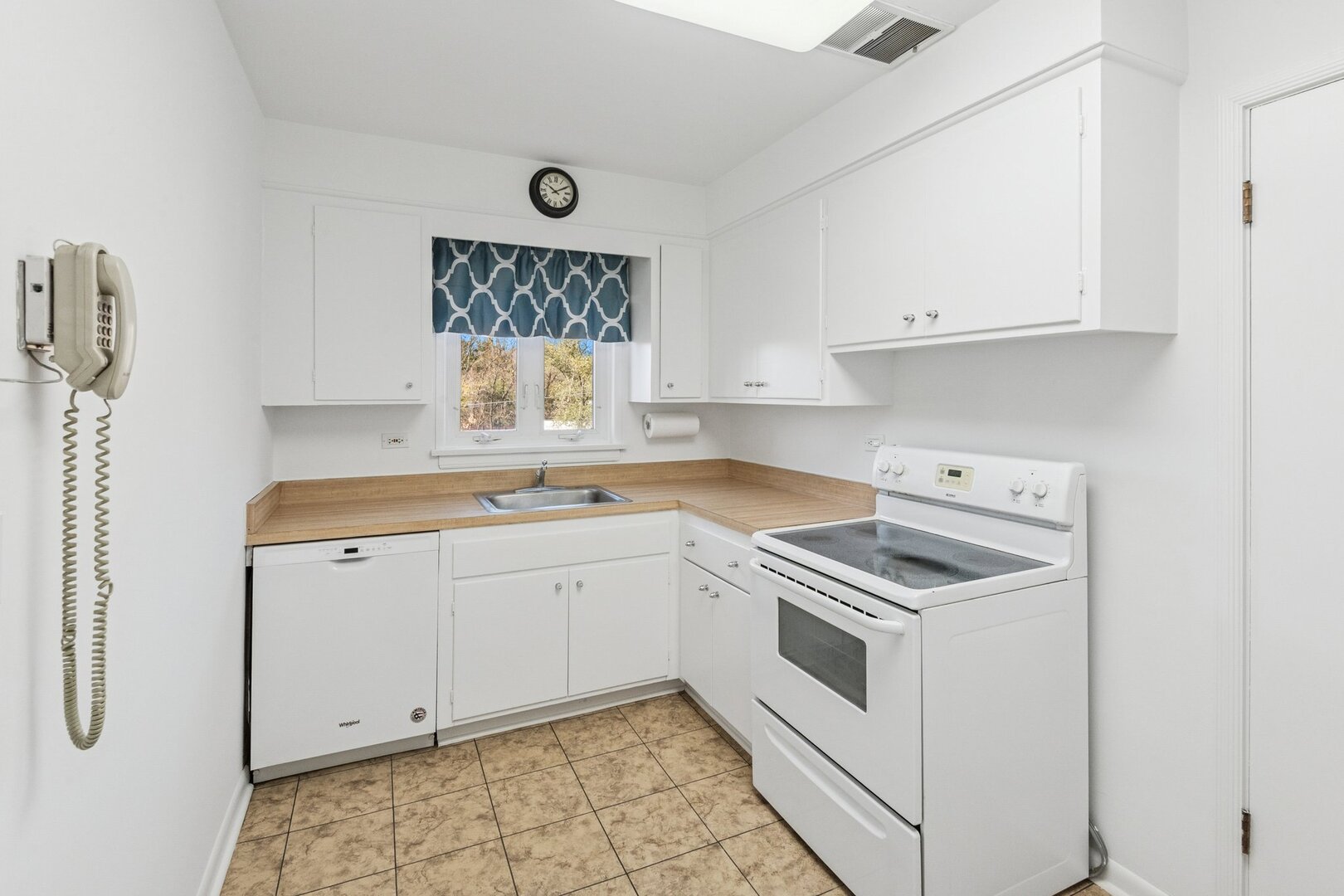 2252 Sherman Avenue, Unit 2 Evanston, IL 60201 - Photo 14 of 24 a kitchen with white cabinets and white appliances