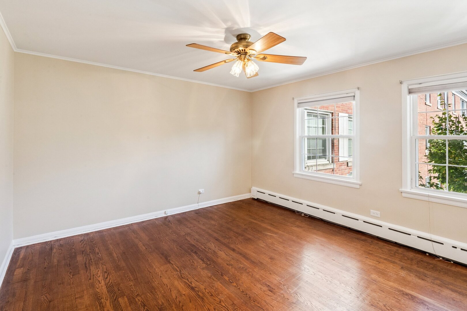2252 Sherman Avenue, Unit 2 Evanston, IL 60201 - Photo 18 of 24 wooden floor in an empty room with a window