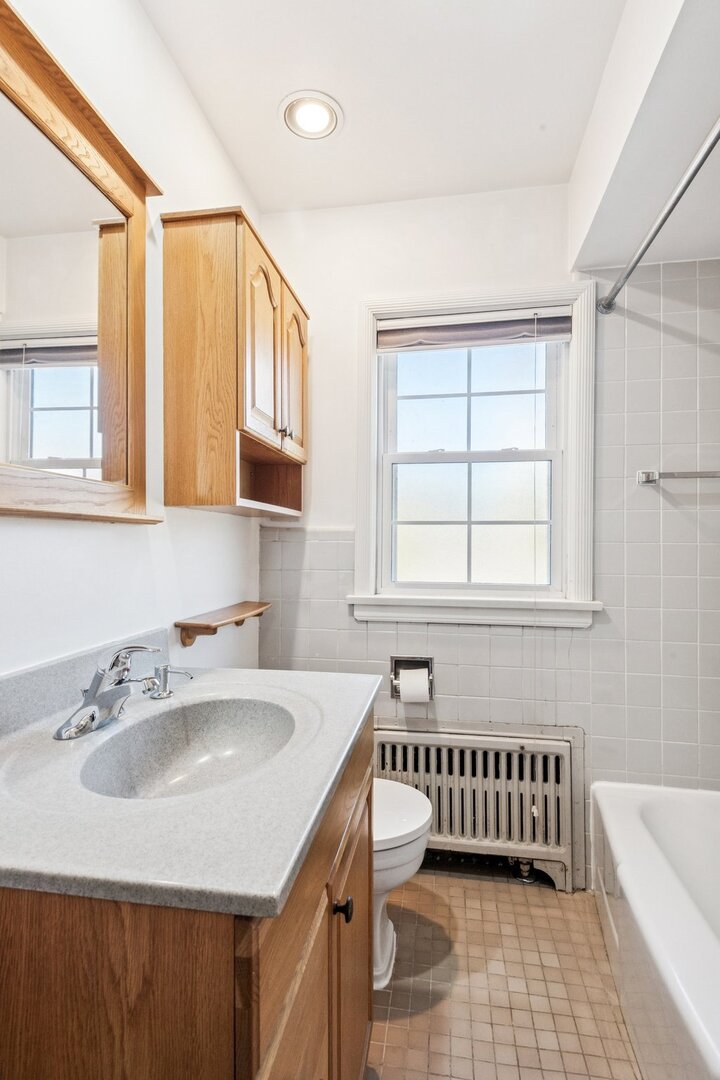 2252 Sherman Avenue, Unit 2 Evanston, IL 60201 - Photo 21 of 24 a bathroom with a sink and a bathtub