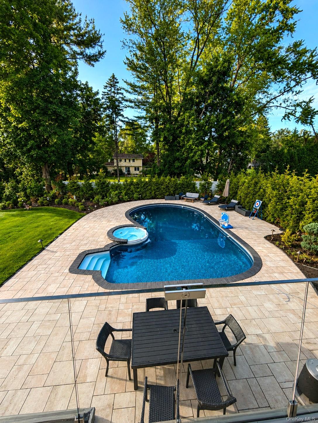 4 Cortland Road Monsey, NY 10952 - Photo 29 of 29 a view of balcony with a table and chairs under an umbrella