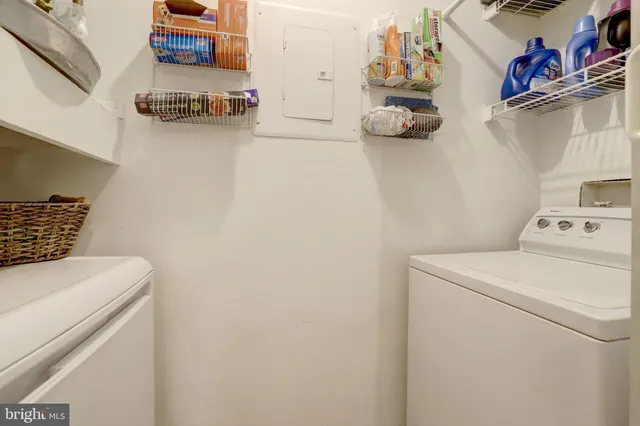 a large bed sitting in a bedroom next to a window