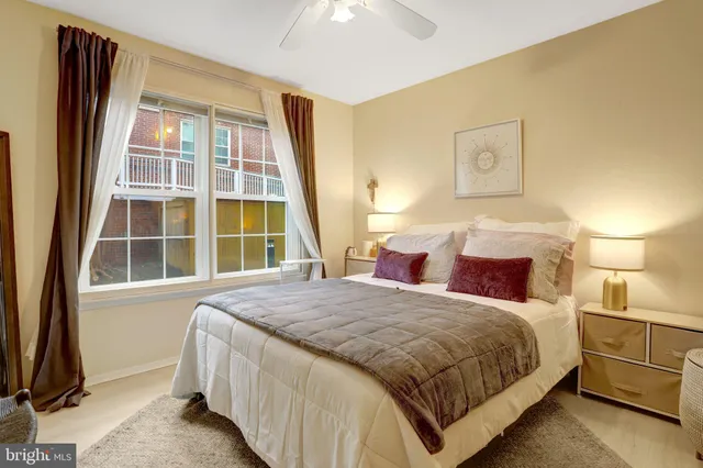 a view of a house with a door and wooden bench