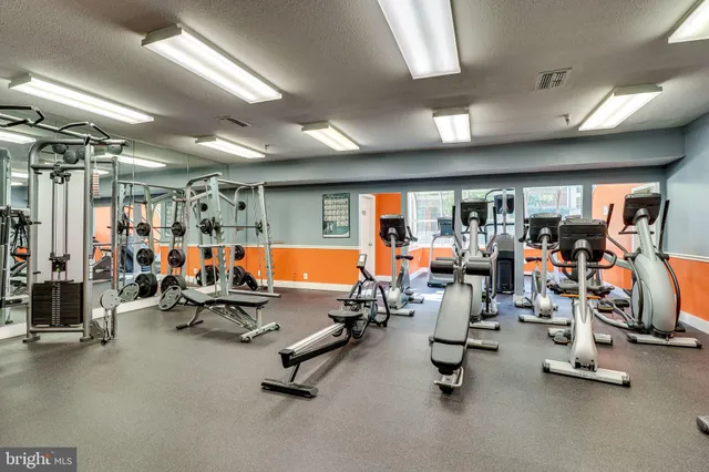 a living room with fireplace furniture and a wooden floor