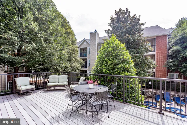 a kitchen with stainless steel appliances granite countertop a stove microwave and refrigerator
