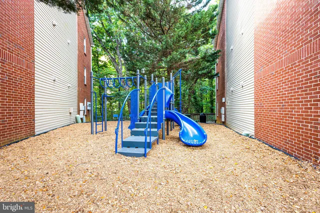 a view of a backyard with swimming pool