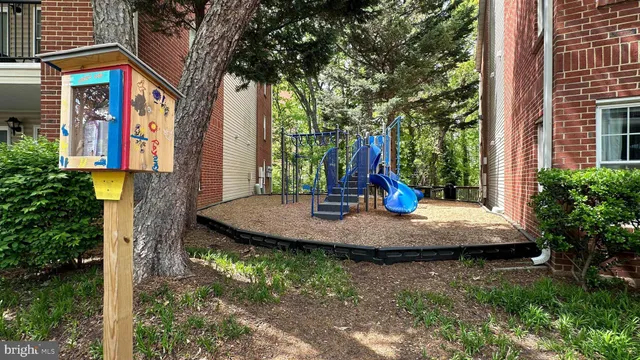 a view of a swimming pool with a yard