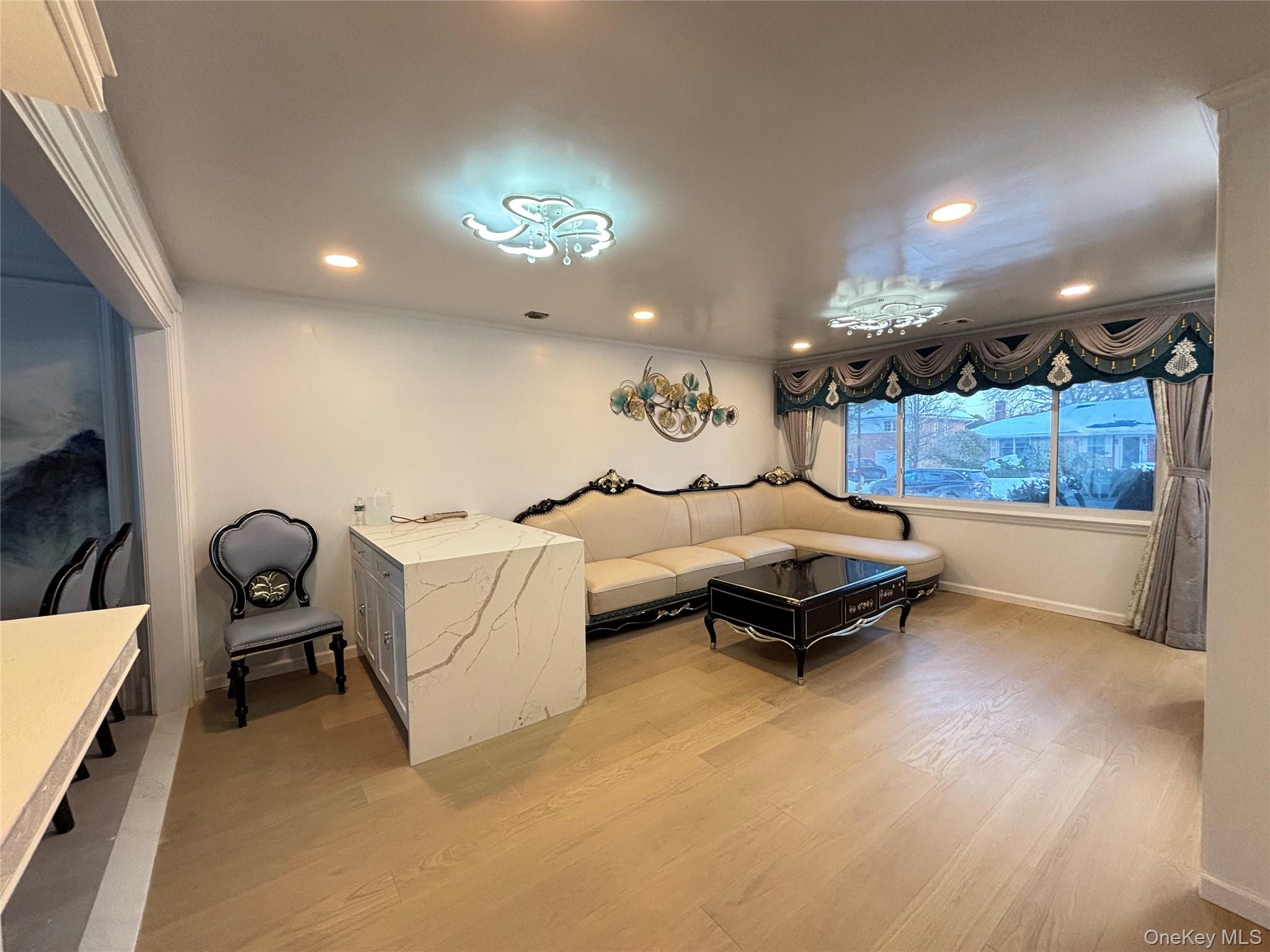 105 Seaman Road Jericho, NY 11753 - Photo 3 of 22 a living room with furniture and a flat screen tv