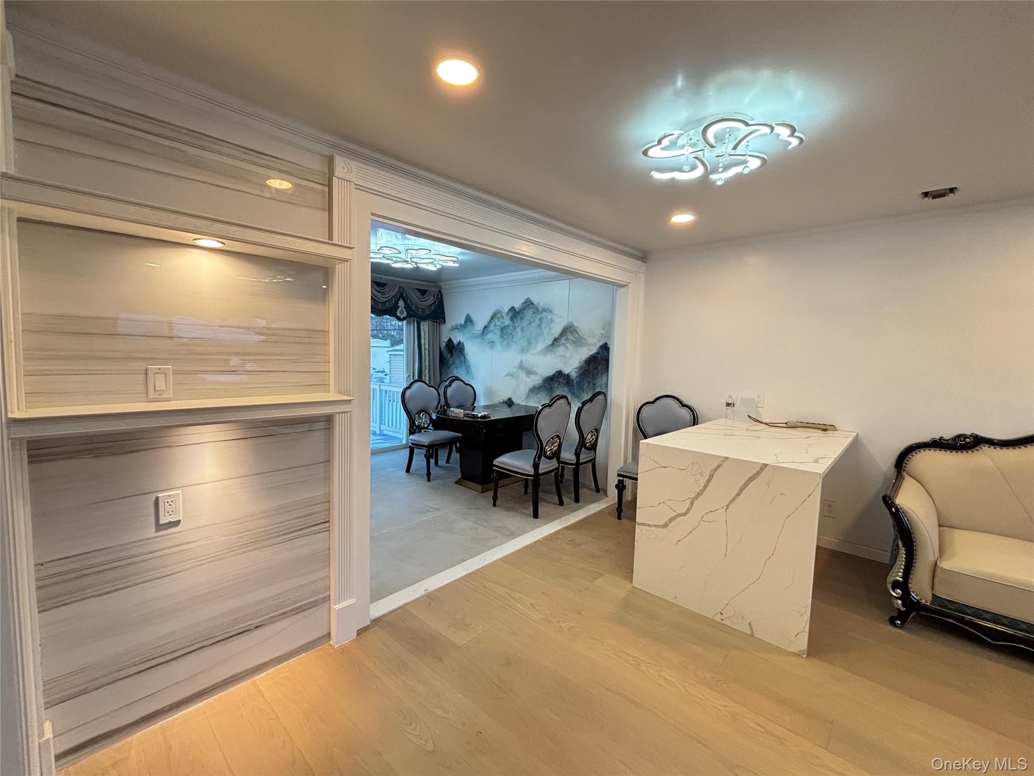 105 Seaman Road Jericho, NY 11753 - Photo 5 of 22 a view of a livingroom with furniture and chandelier