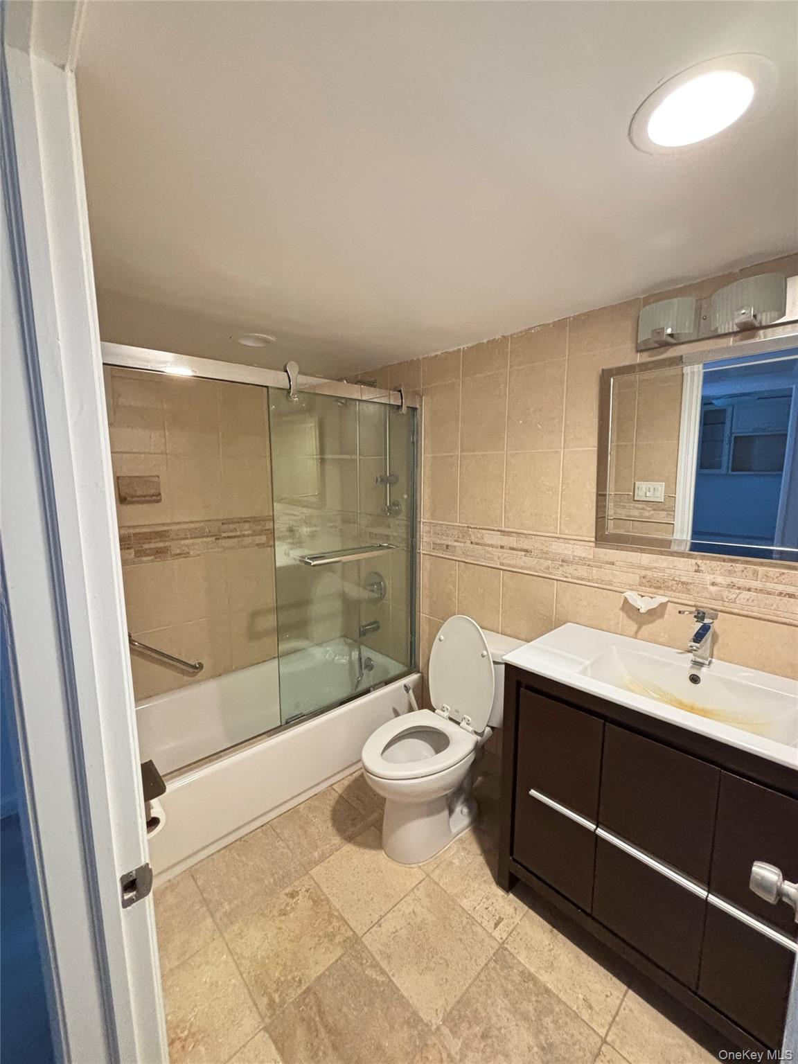 105 Seaman Road Jericho, NY 11753 - Photo 8 of 22 a bathroom with a sink toilet and shower