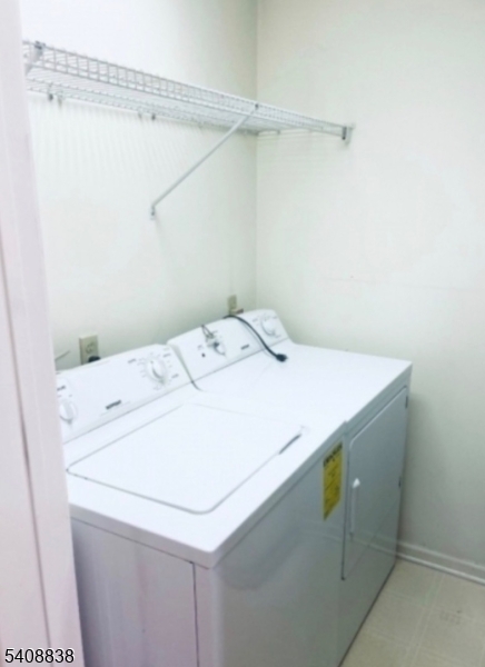 64 Isabella Avenue Newark, NJ 07106 - Photo 6 of 8 a utility room with dryer and washer