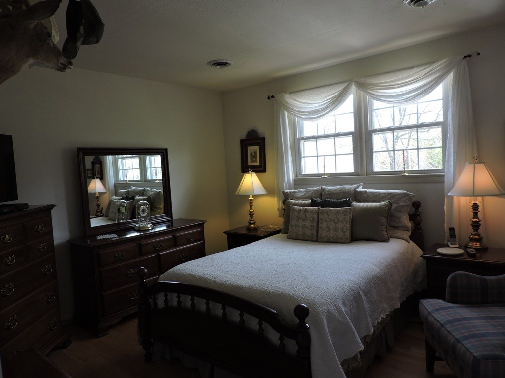 68 Purple Cow Road Waynesboro, VA 22980 - Photo 9 of 22 a bedroom with a bed and wooden floor