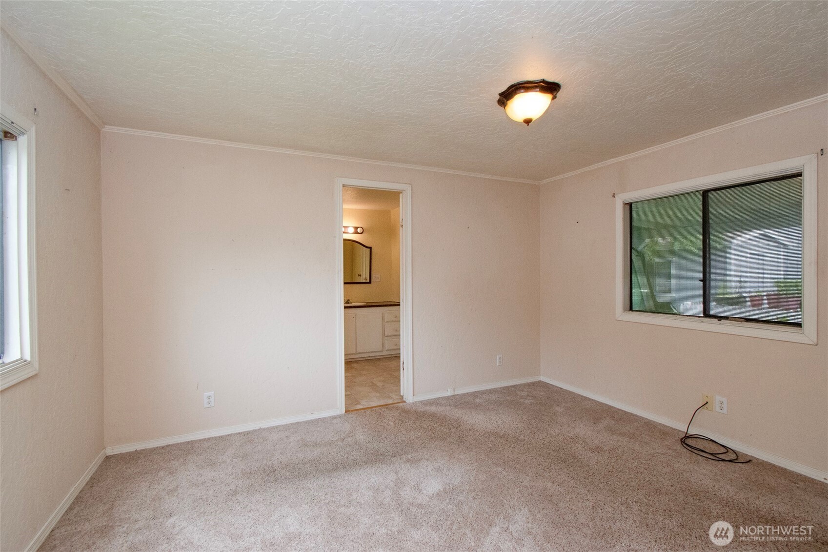 90 Baywood Village Road, Unit 34 Sequim, WA 98382 - Photo 27 of 40 a view of an empty room with a window