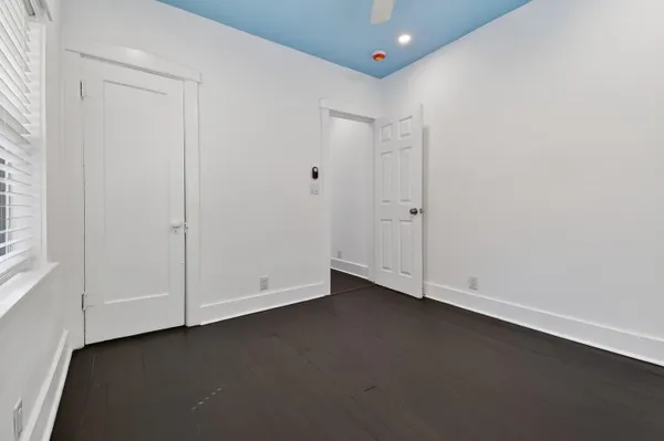 an empty room with closet area