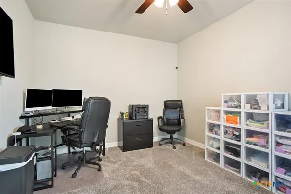 a view of a workspace with furniture