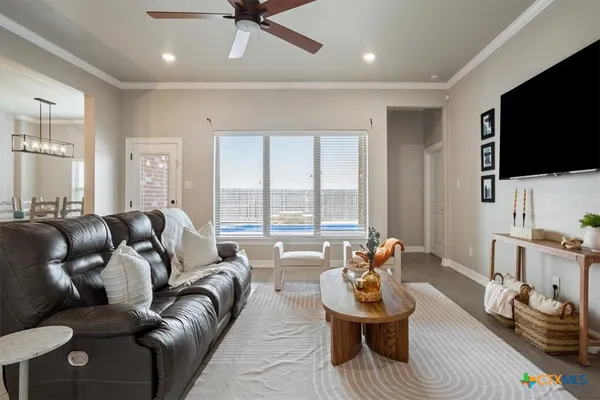 a living room with furniture and a flat screen tv
