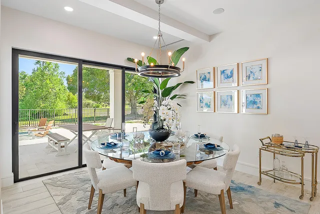 a bedroom with bed and a large window