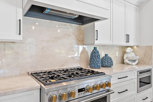 a bedroom with a large bed and a large window