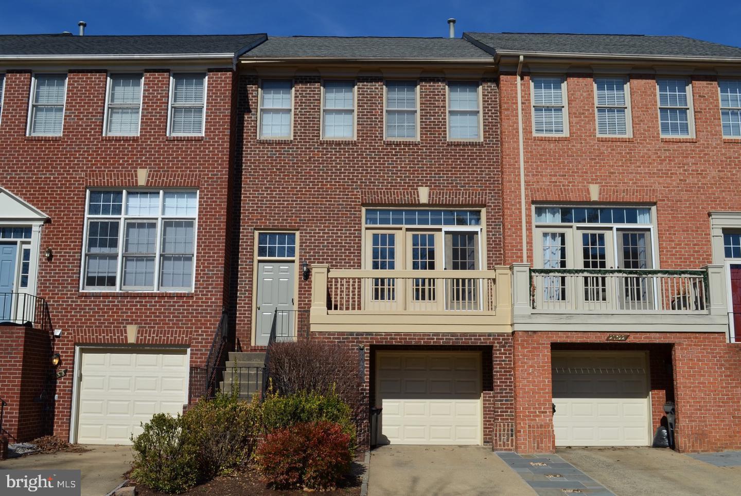 a front view of a building with a lot of windows