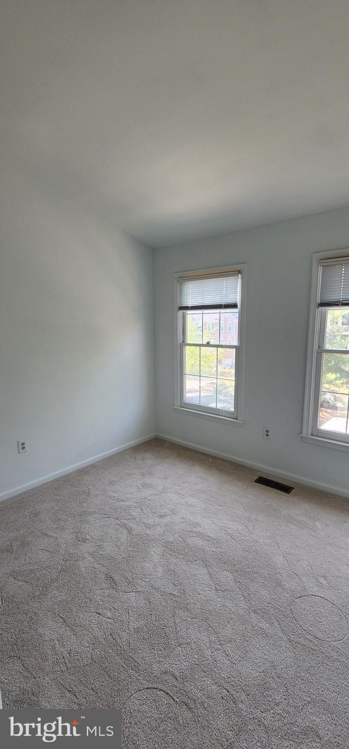 20320 Burnley Square Sterling, VA 20165 - Photo 16 of 22 an empty room with windows