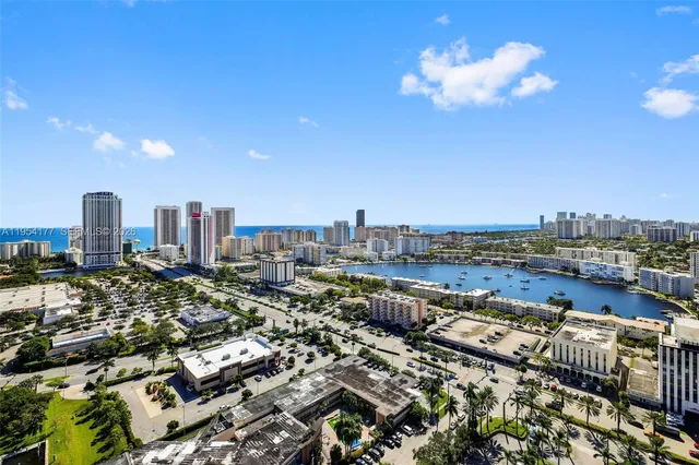 a room with furniture a flat screen tv and a large window