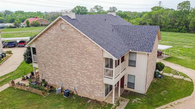 a aerial view of a house with a yard