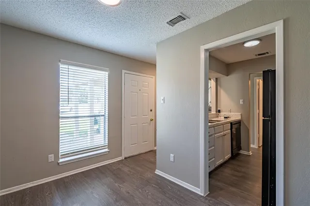 a view of a kitchen with a stove cabinets and wooden floor