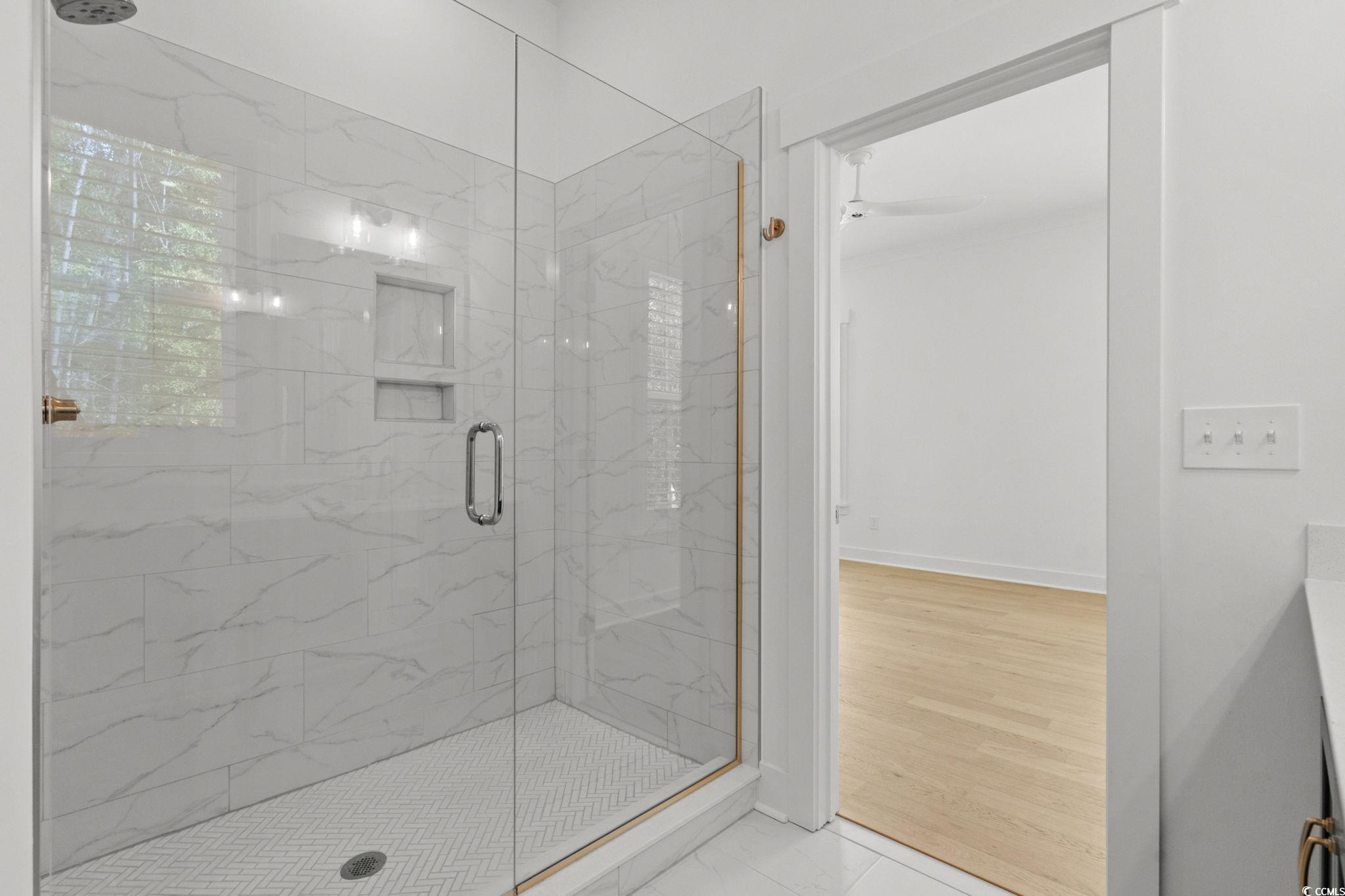 477 Ayrhill Loop Myrtle Beach, SC 29588 - Photo 23 of 39 Full bath with a marble finish shower, light tile patterned floors, and vanity