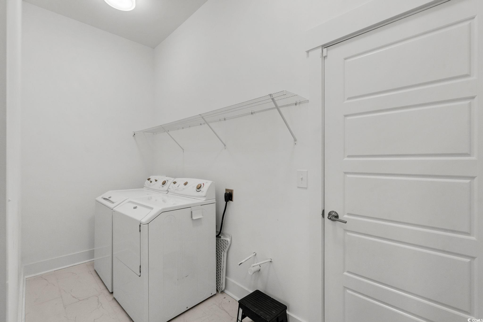 477 Ayrhill Loop Myrtle Beach, SC 29588 - Photo 27 of 39 Laundry room with washer and dryer and light marble finish floors