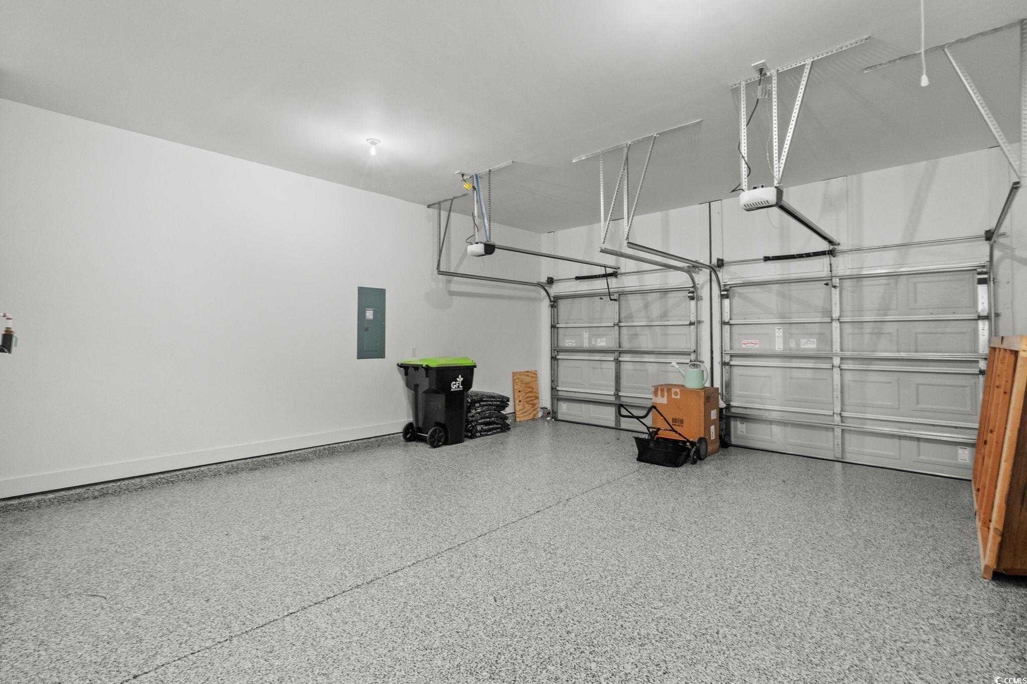 477 Ayrhill Loop Myrtle Beach, SC 29588 - Photo 28 of 39 Garage featuring electric panel and baseboards