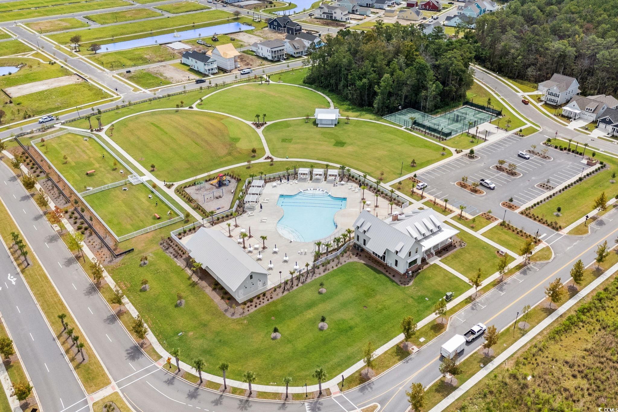 477 Ayrhill Loop Myrtle Beach, SC 29588 - Photo 31 of 39 Drone / aerial view of a pool and a nearby body of water