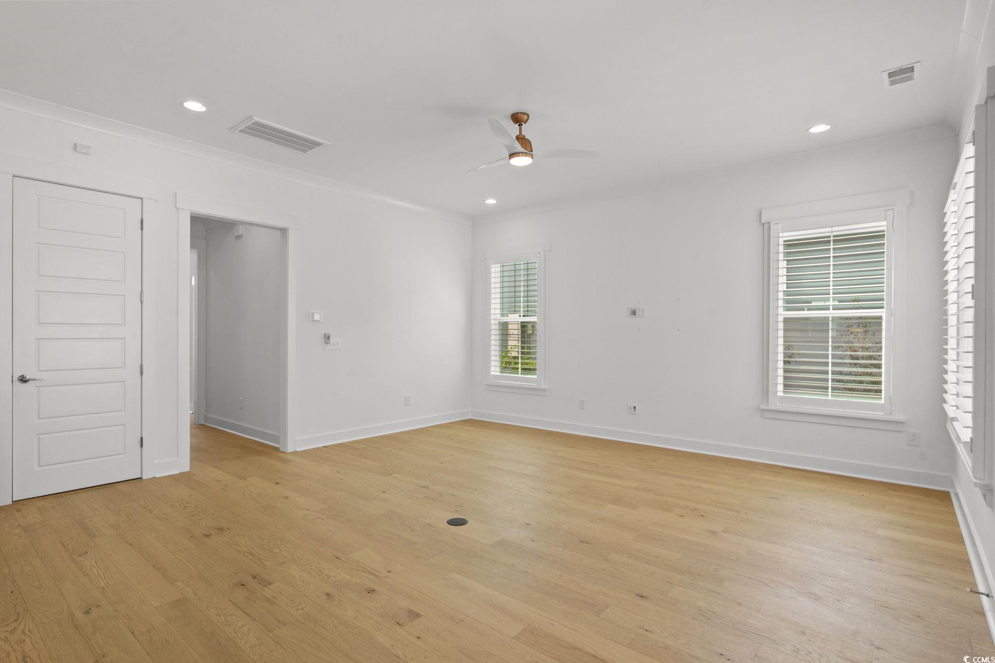 477 Ayrhill Loop Myrtle Beach, SC 29588 - Photo 7 of 39 Unfurnished room featuring light wood finished floors, recessed lighting, and ceiling fan