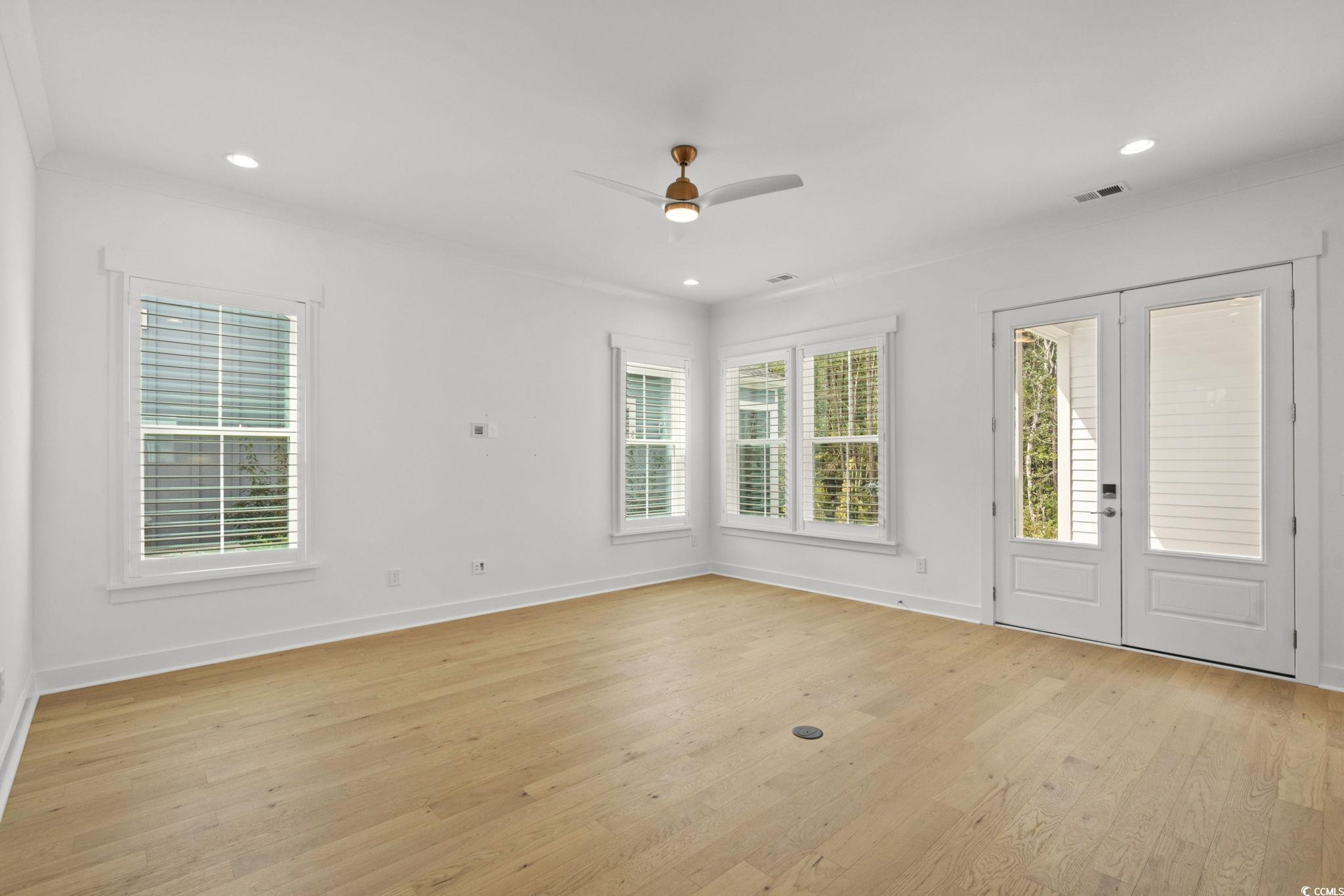 477 Ayrhill Loop Myrtle Beach, SC 29588 - Photo 8 of 39 Entrance foyer with plenty of natural light, light wood-type flooring, a ceiling fan, recessed lighting, and french doors