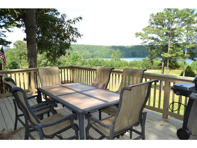 118 Indian Ridge Waleska, GA 30183 - Photo 1 of 1 Patio/Deck. Sprawling rear deck allows for grilling & al fresco dining overlooking crystal blue Lake Arrowhead!