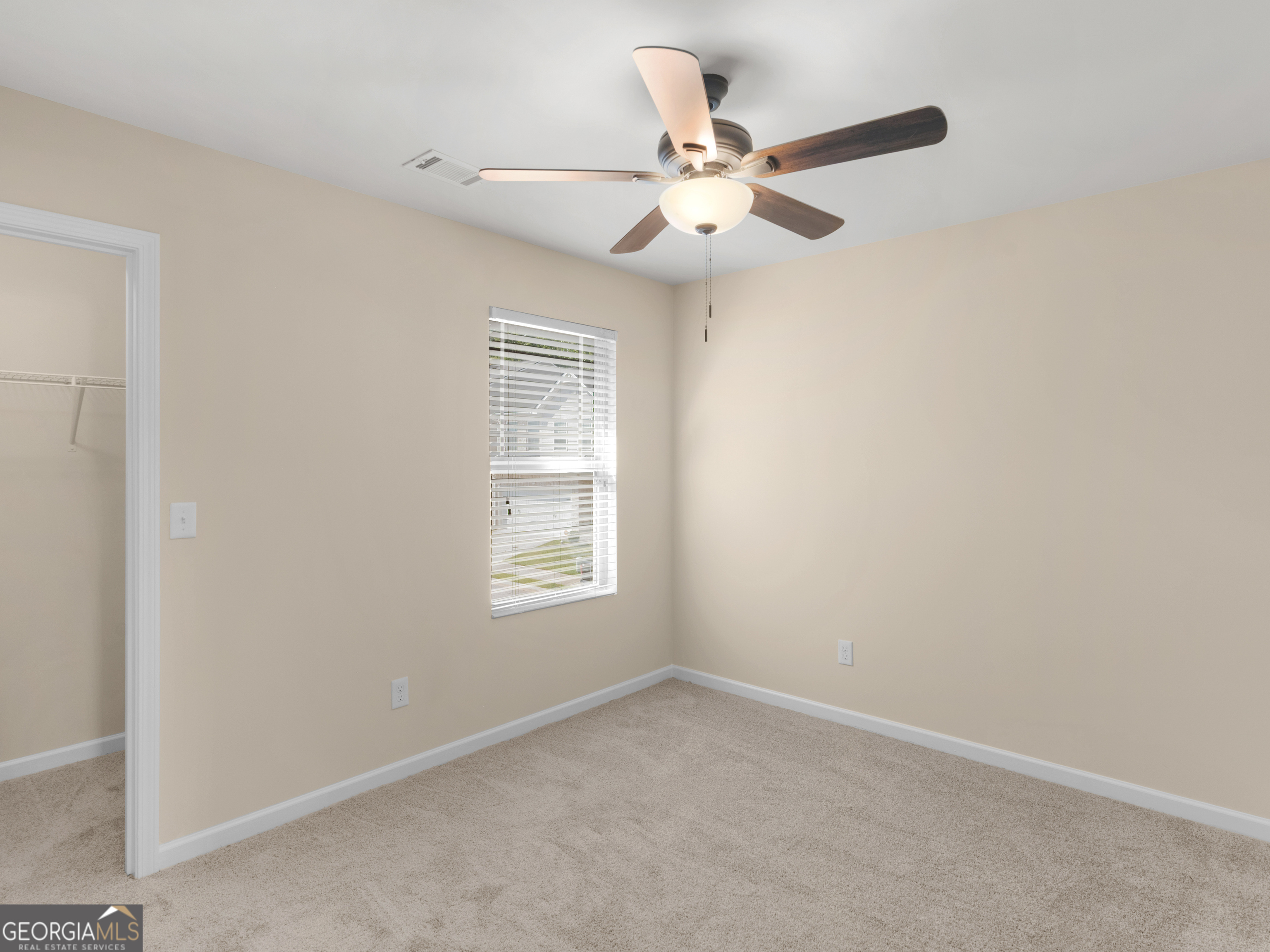 1244 Faye Court McDonough, GA 30253 - Photo 16 of 35 an empty room with windows and fan