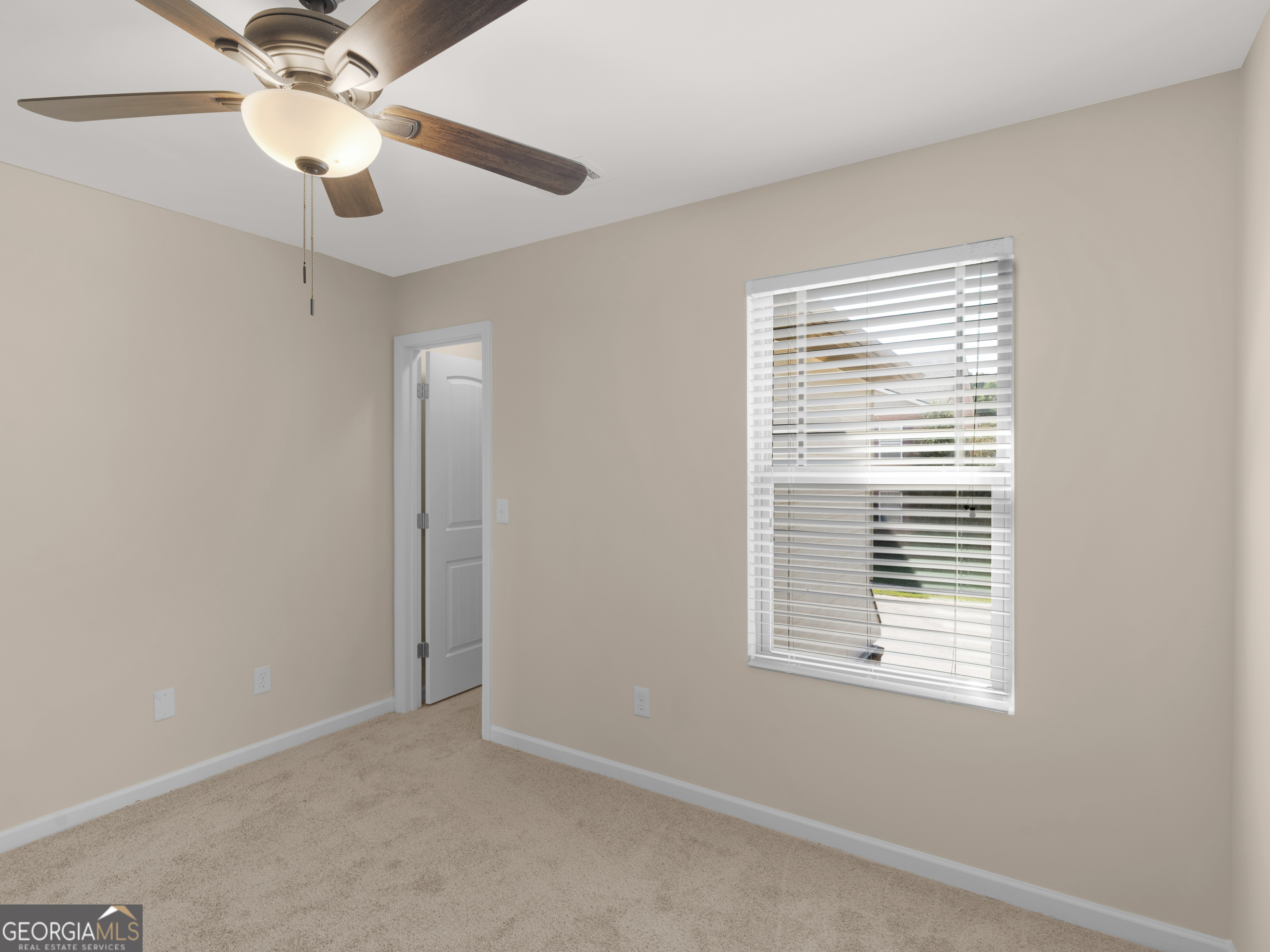 1244 Faye Court McDonough, GA 30253 - Photo 17 of 35 a view of an empty room with a window