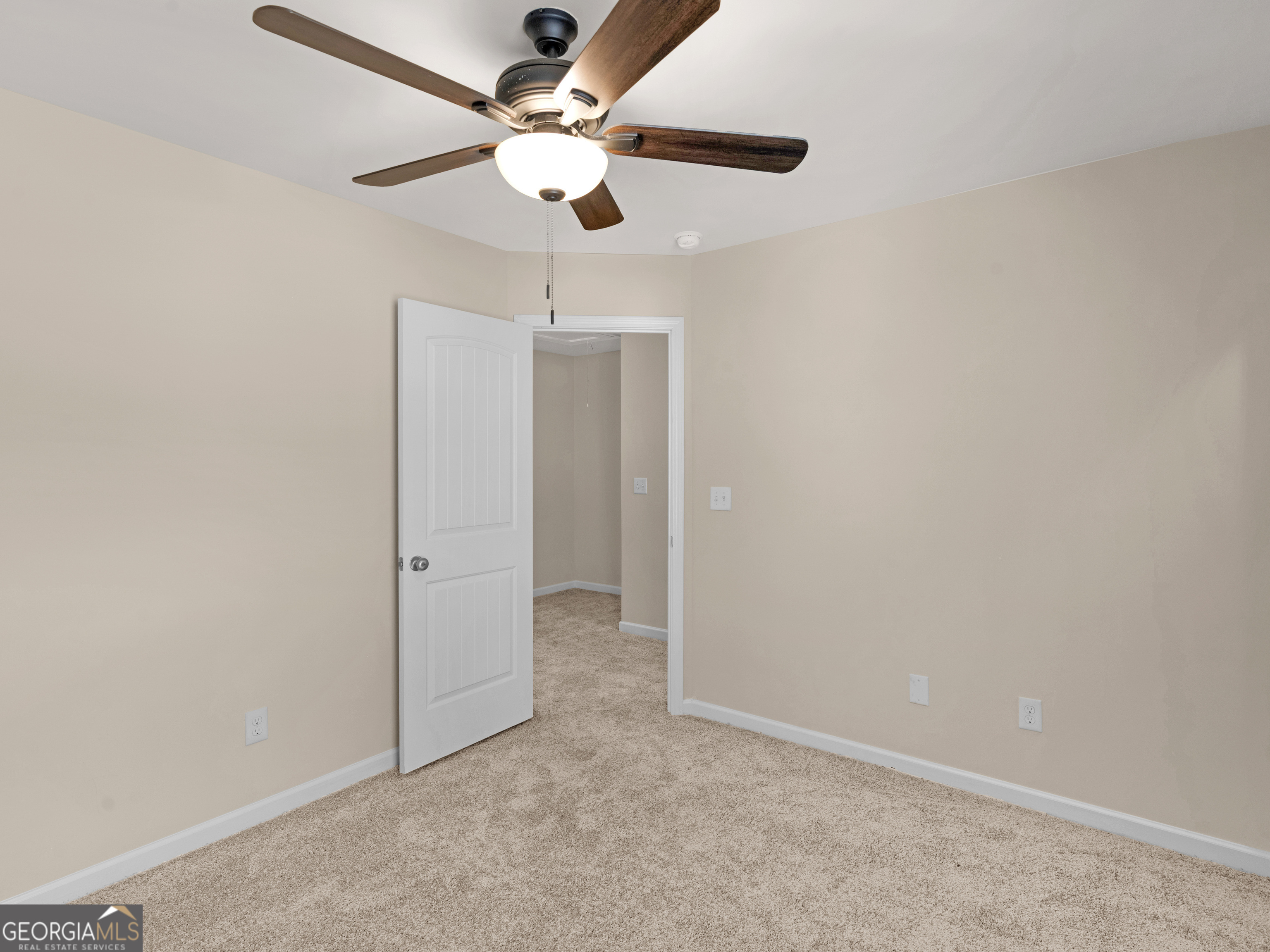 1244 Faye Court McDonough, GA 30253 - Photo 18 of 35 an empty room with a fan & a ceiling fan