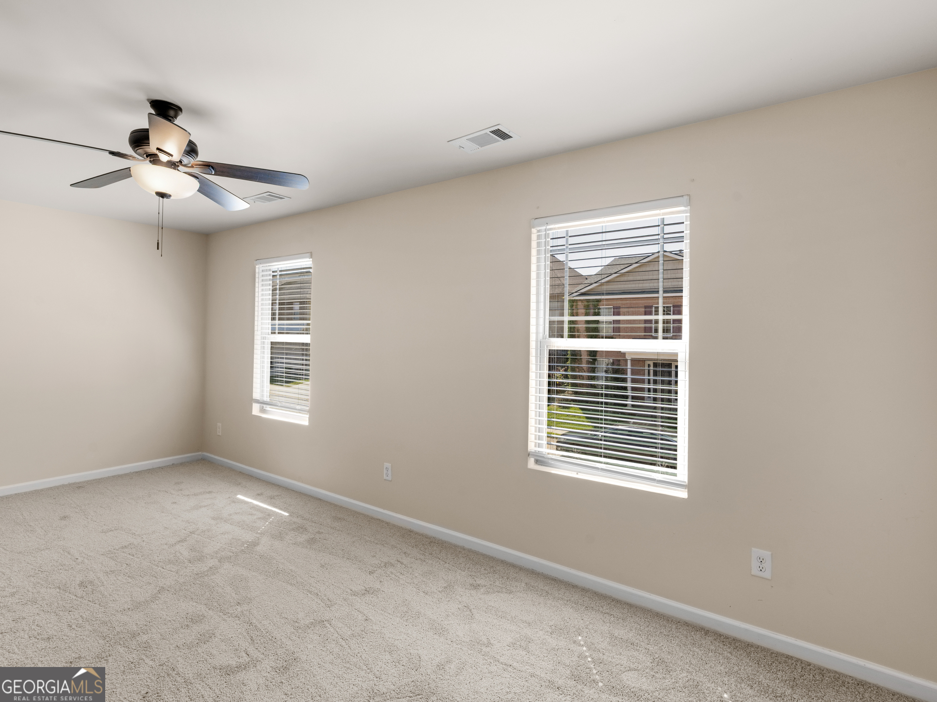 1244 Faye Court McDonough, GA 30253 - Photo 21 of 35 a view of an empty room with a window