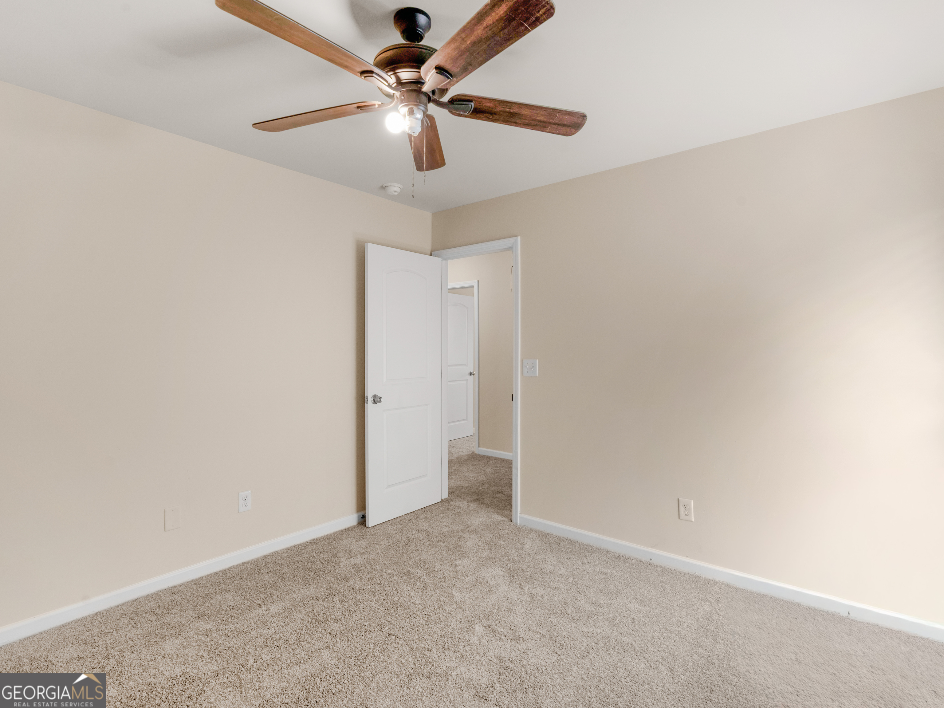 1244 Faye Court McDonough, GA 30253 - Photo 26 of 35 an empty room with a fan and a fan