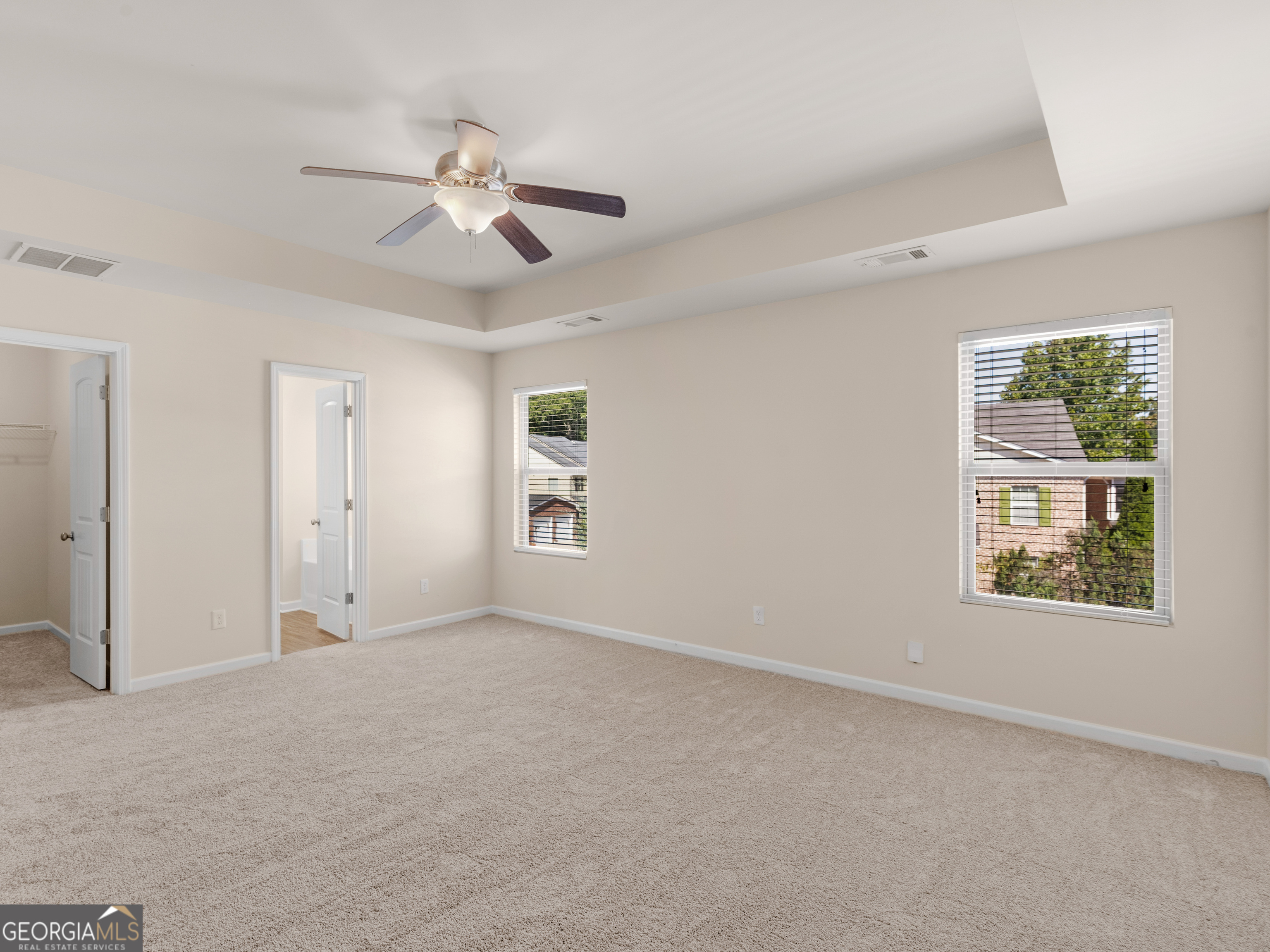 1244 Faye Court McDonough, GA 30253 - Photo 28 of 35 an empty room with windows and fan