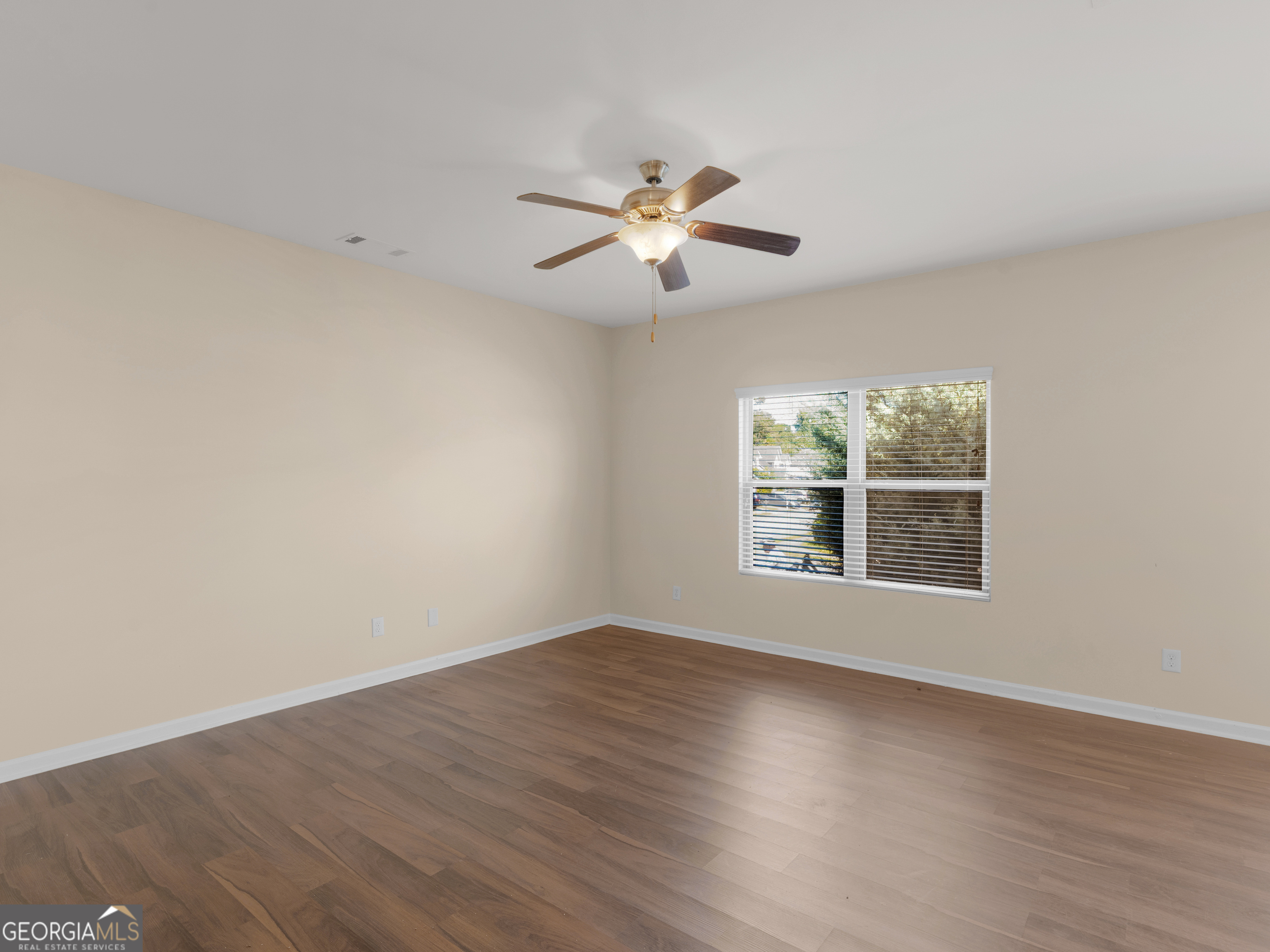 1244 Faye Court McDonough, GA 30253 - Photo 3 of 35 wooden floor in an empty room with a window