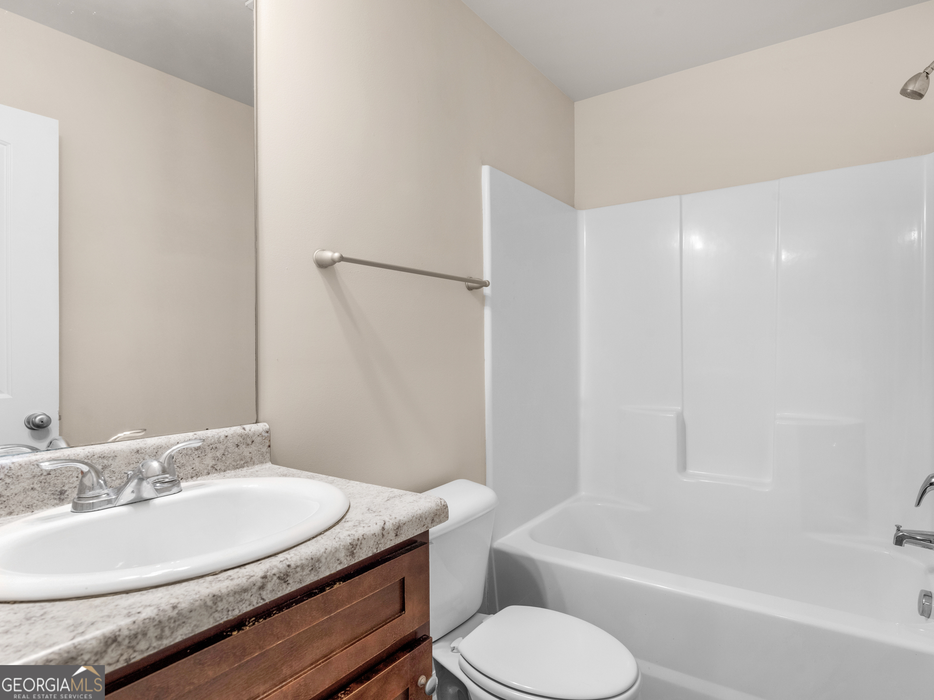 1244 Faye Court McDonough, GA 30253 - Photo 31 of 35 a bathroom with a granite countertop sink toilet and shower