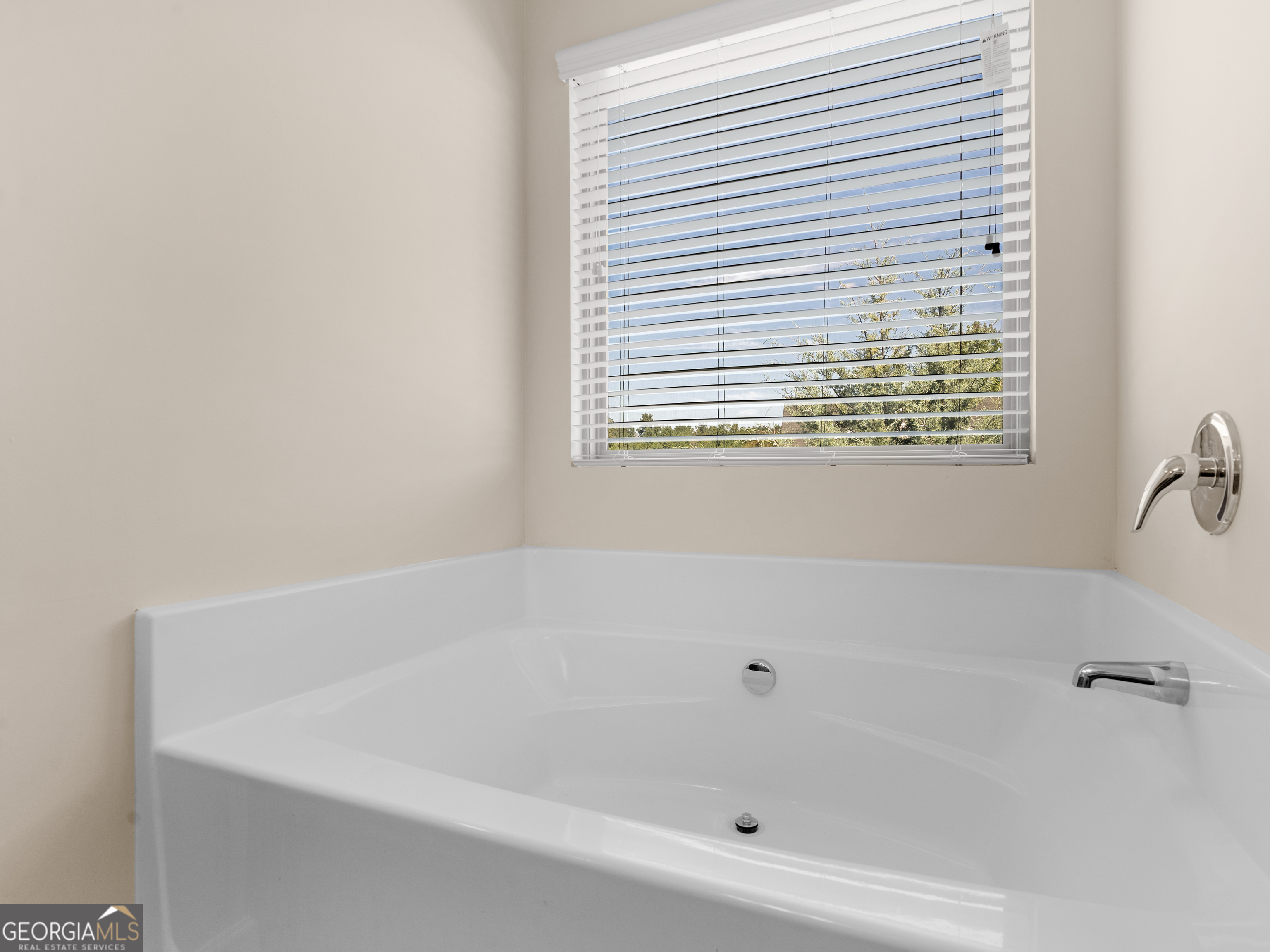 1244 Faye Court McDonough, GA 30253 - Photo 33 of 35 a white bath tub sitting next to a window