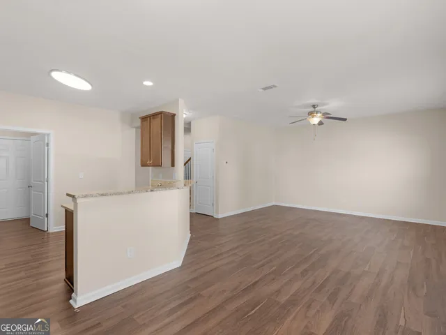 a view of livingroom with hardwood and furniture