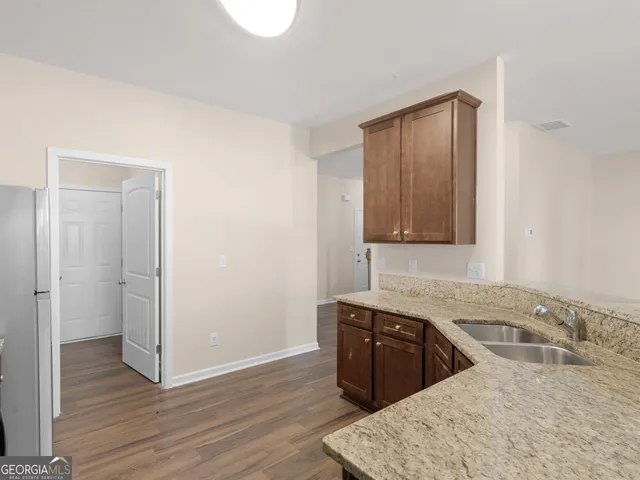 a view of a kitchen from the hallway