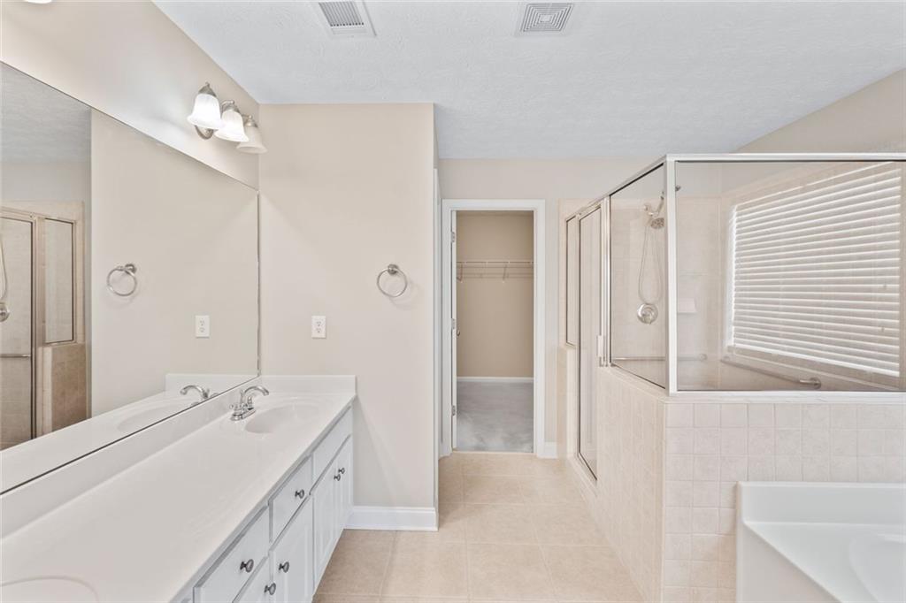 241 Red Bud Road Jefferson, GA 30549 - Photo 27 of 43 a bathroom with a double vanity sink mirror and double