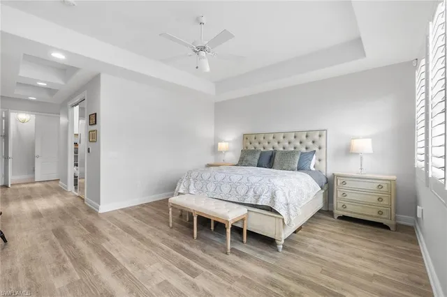 a bedroom with a bed and a table