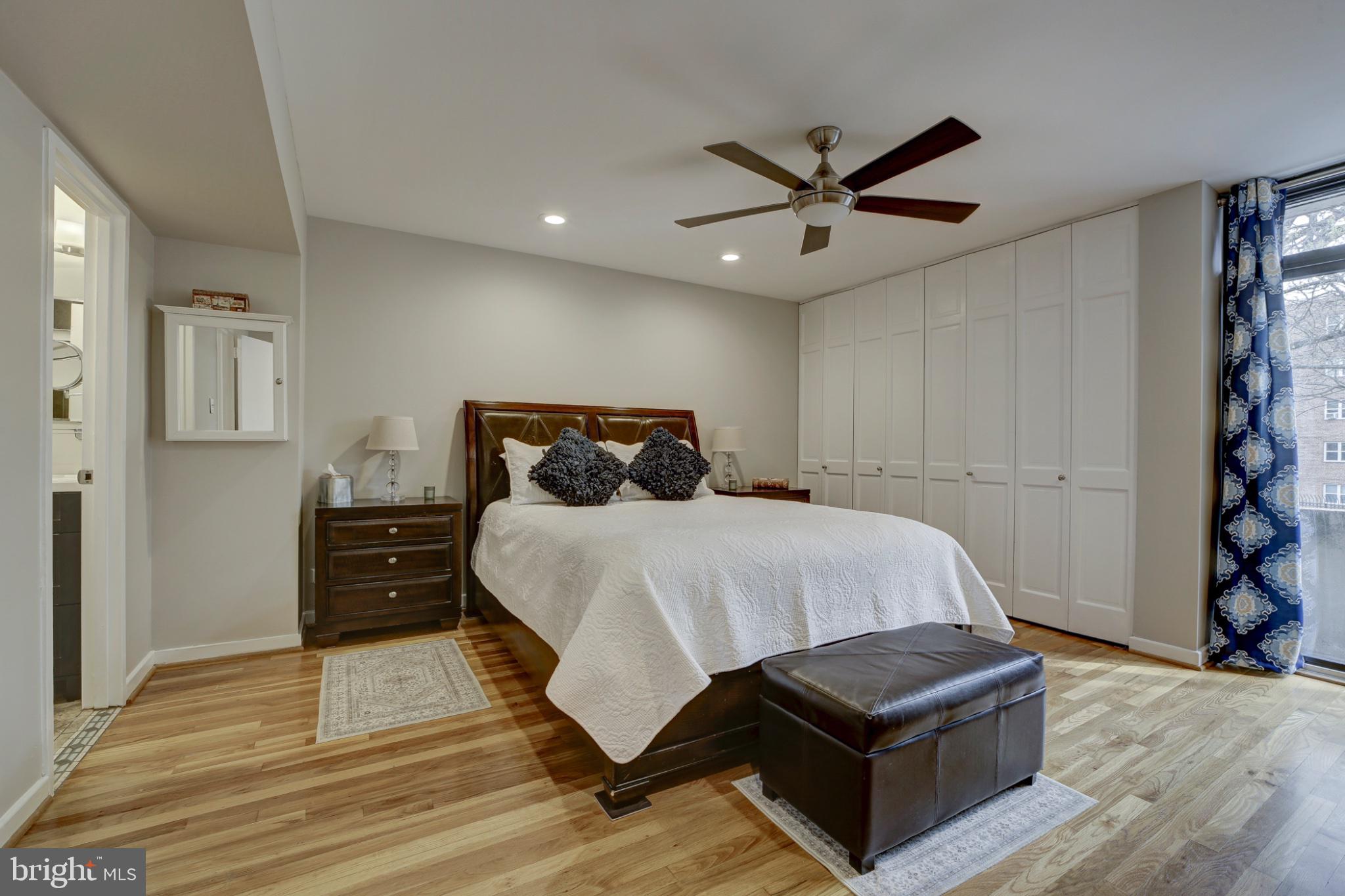 1273 Delaware Avenue Southwest Washington, DC 20024 - Photo 12 of 32 a bedroom with a bed and a ceiling fan
