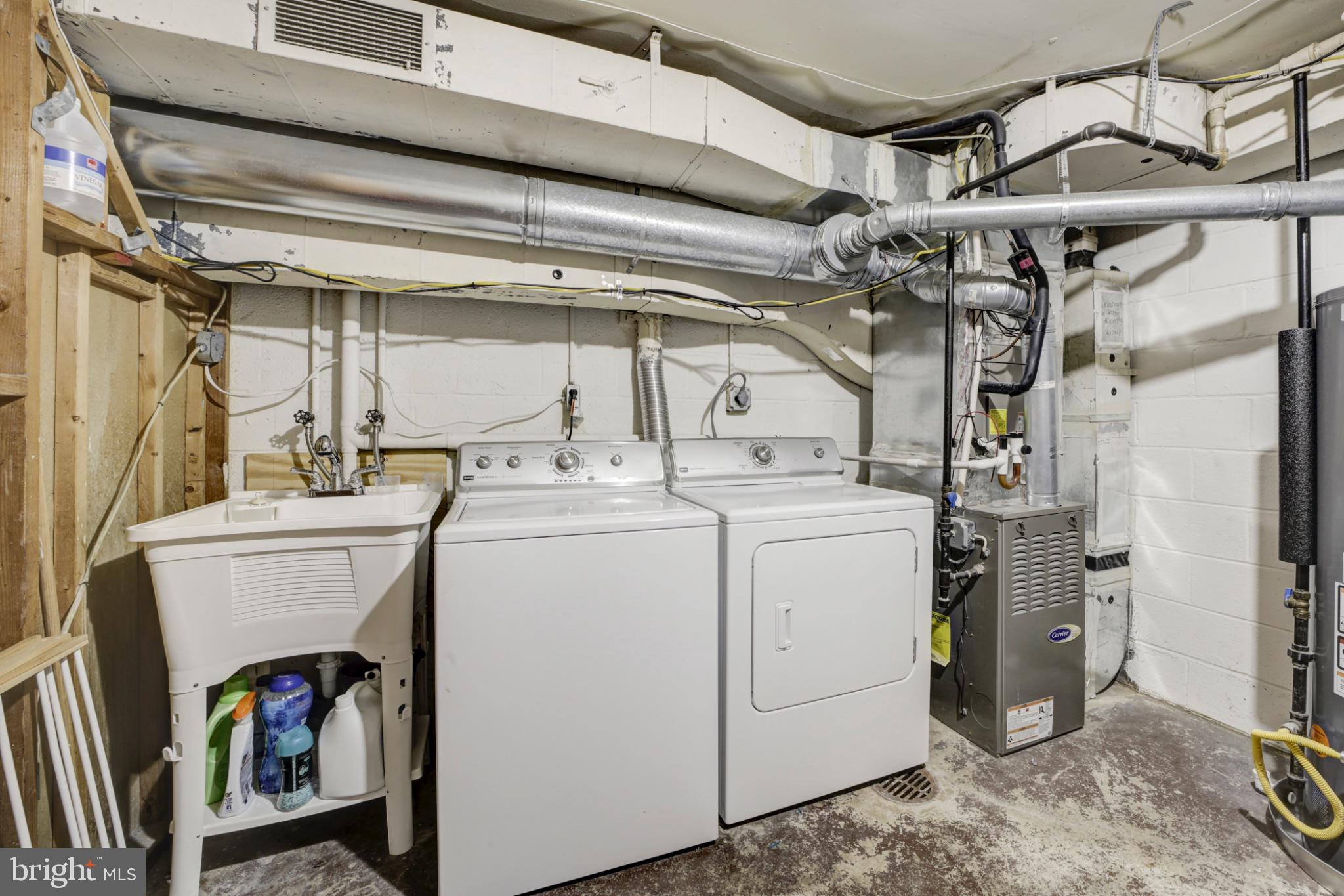 1273 Delaware Avenue Southwest Washington, DC 20024 - Photo 17 of 32 a utility room with dryer and washer